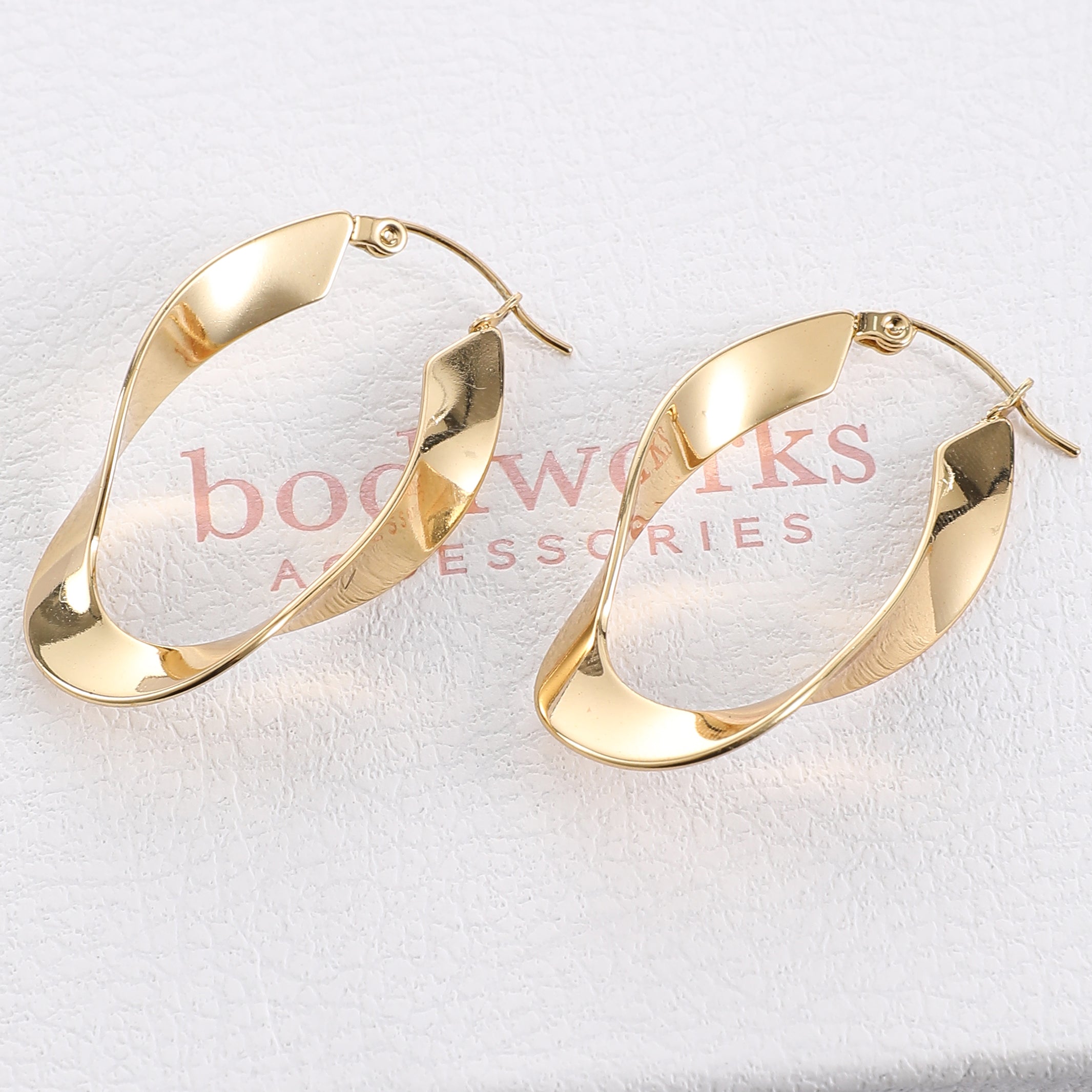 Gold Twist Oval Hoop Earrings